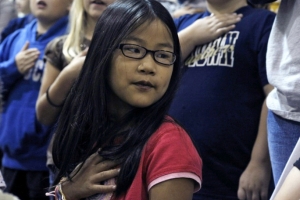 Carla's oldest daughter, Carissa, says the pledge of allegiance with her classmates at Morningside Elementary School.  Carissa was adopted as an infant from China and has been an American citizen her entire life.