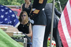 Elain Farren awaits the presentation of the flag off of her son, Lance Cpl. Roger Hager's, coffin. Hager, 20, was killed after the explosion of a humvee he was riding in Afghanistan.