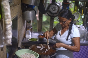 Grace Jimenéz pulls apart lionfish filets to make ceviche. Jimenéz developed the now popular ceviche recipe that is mimicked by restaurants throughout the Southern Caribbean.