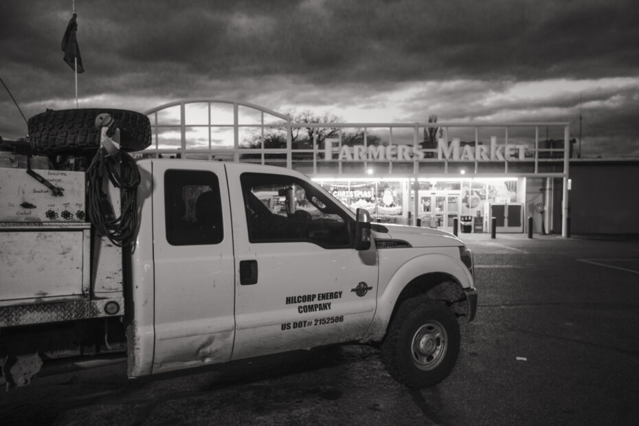 A Hilcorp Energy truck parked in front of the Farmers Market in Bloomfield. Packed full of gas-field workers every morning as they grab food for the backroads, the market serves as a barometer of the health of the energy industry in the San Juan Basin. Nadav Soroker/Searchlight New Mexico